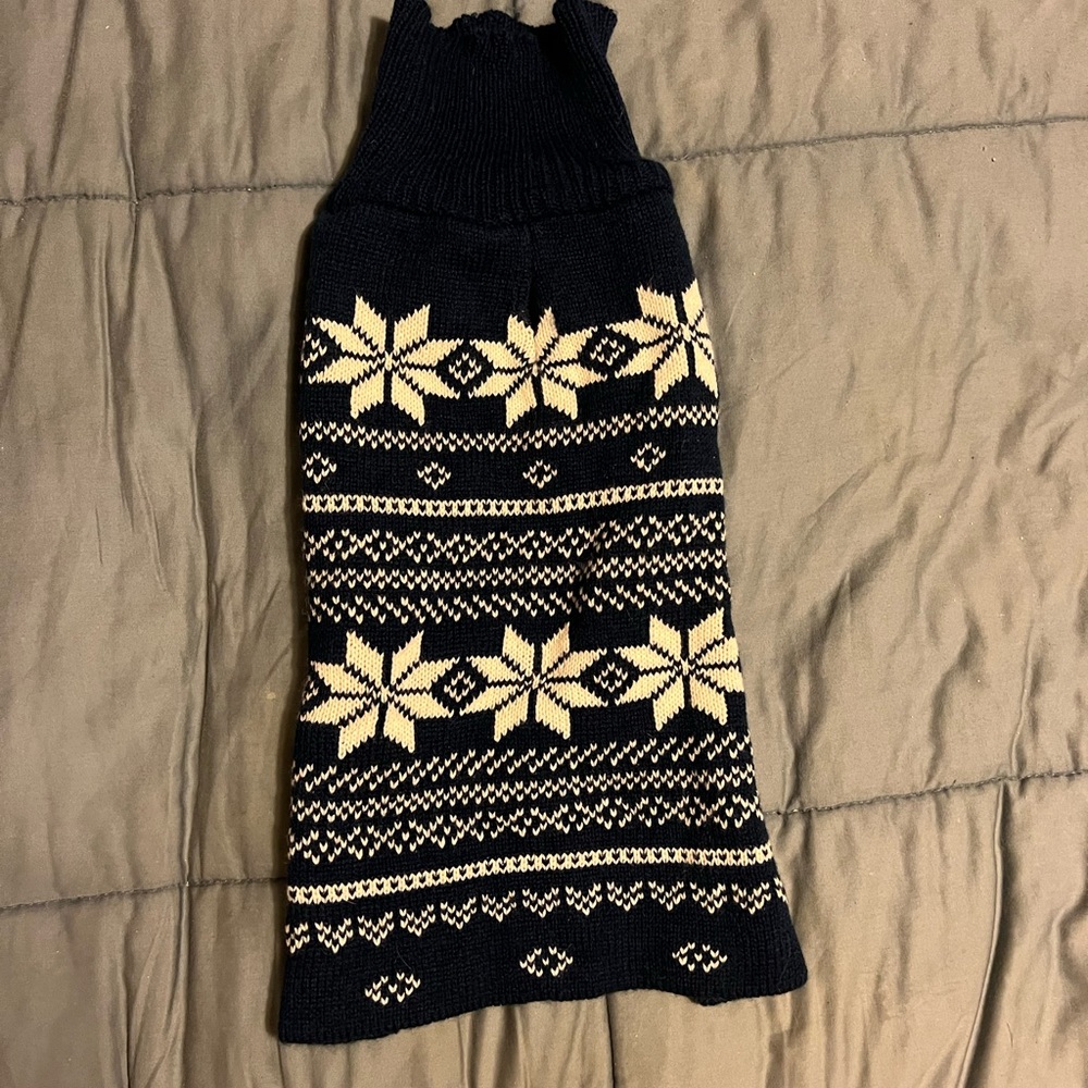 Navy blue dog sweater with snowflake pattern for small dog.